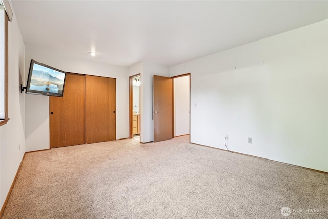 21850 SE 271st Pl, Maple Valley, WA 98038 - unfurnished bedroom with carpet flooring, a closet, and connected bathroom