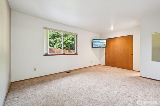 21850 SE 271st Pl, Maple Valley, WA 98038 - unfurnished bedroom featuring carpet and a closet