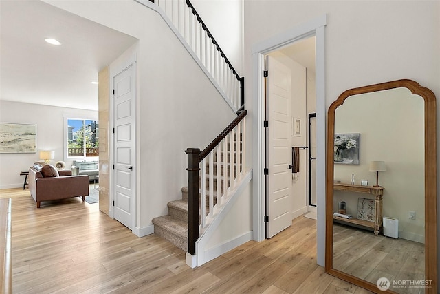 18740 130th St E, Bonney Lake, WA 98391 - stairway featuring wood finished floors and recessed lighting