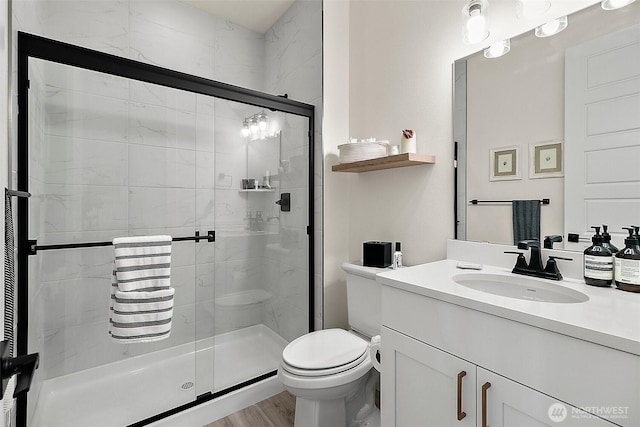 18740 130th St E, Bonney Lake, WA 98391 - full bathroom featuring a shower stall, vanity, and wood finished floors