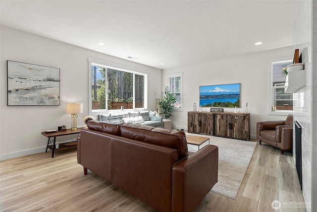 18740 130th St E, Bonney Lake, WA 98391 - living room featuring light wood-style flooring and recessed lighting