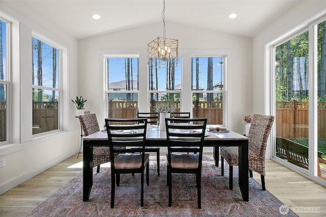 18740 130th St E, Bonney Lake, WA 98391 - dining space featuring a chandelier, healthy amount of natural light, vaulted ceiling, light wood-style floors, and recessed lighting