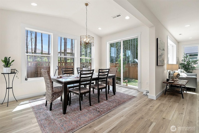 18740 130th St E, Bonney Lake, WA 98391 - dining area featuring light wood finished floors, a chandelier, lofted ceiling, and recessed lighting