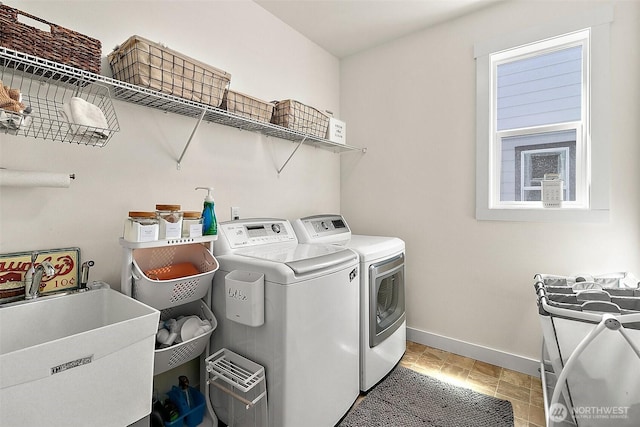 18740 130th St E, Bonney Lake, WA 98391 - laundry area featuring baseboards and washing machine and clothes dryer