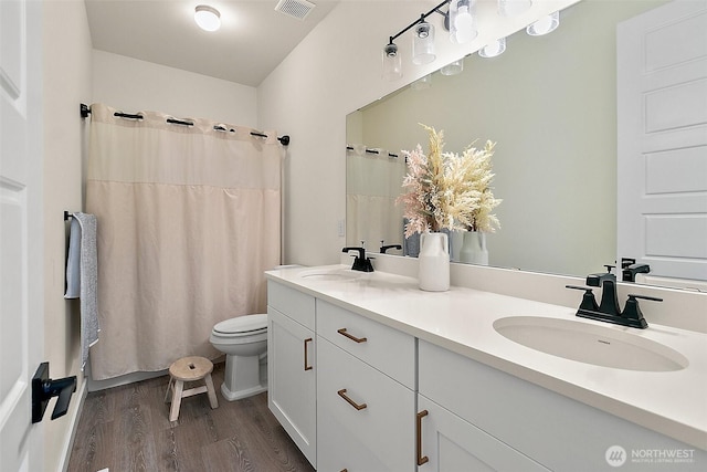 18740 130th St E, Bonney Lake, WA 98391 - full bath with wood finished floors, double vanity, and curtained shower