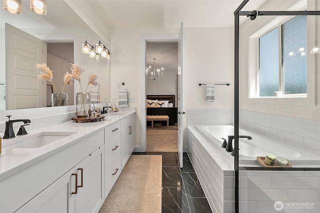 18740 130th St E, Bonney Lake, WA 98391 - full bathroom featuring connected bathroom, double vanity, a bath, granite tiled floors, and a chandelier