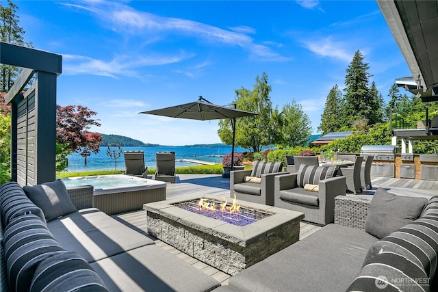 3231 Northshore Rd, Bellingham, WA 98226 - view of patio / terrace with a water view, a hot tub, area for grilling, and an outdoor living space with a fire pit