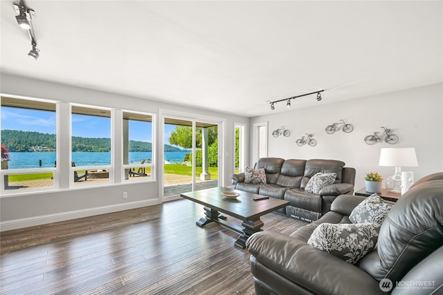 3231 Northshore Rd, Bellingham, WA 98226 - living area with rail lighting, wood finished floors, and a water view