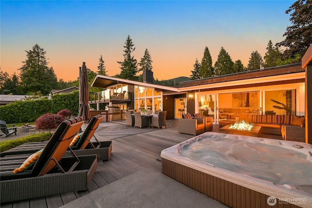 3231 Northshore Rd, Bellingham, WA 98226 - deck at dusk with outdoor dining space and an outdoor living space with a fire pit