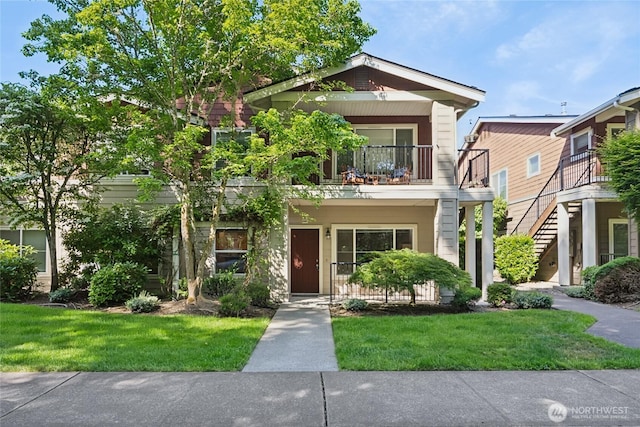 2147 Hammond Ave Unit B10, Dupont, WA 98327 - view of front facade with a balcony and a front yard