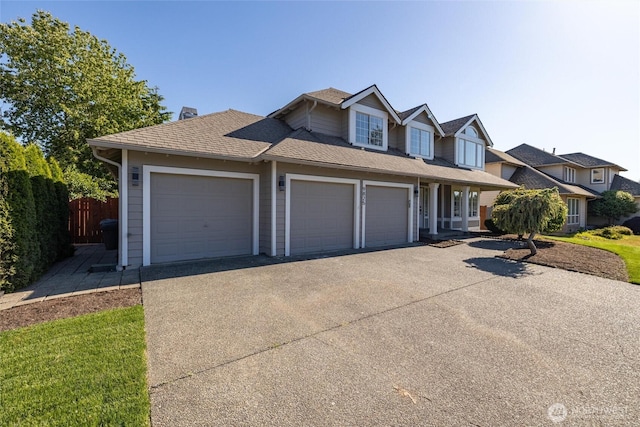 9825 S 246th Pl, Kent, WA 98030 - view of front of house featuring driveway, a garage, and roof with shingles