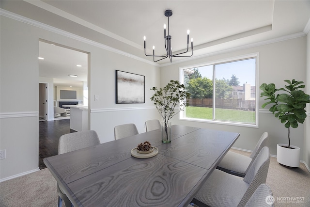 9825 S 246th Pl, Kent, WA 98030 - dining room featuring a chandelier, a tray ceiling, crown molding, and carpet