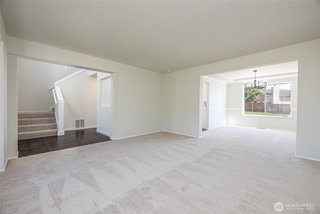 9825 S 246th Pl, Kent, WA 98030 - unfurnished living room featuring carpet, a chandelier, and stairs
