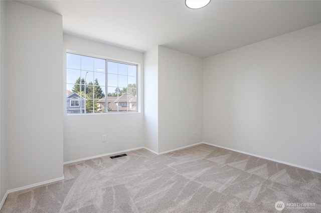 9825 S 246th Pl, Kent, WA 98030 - spare room featuring carpet flooring and baseboards