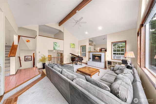 21 Longshore Ln, Bellingham, WA 98229 - living area featuring ceiling fan, beamed ceiling, high vaulted ceiling, a tile fireplace, and stairway