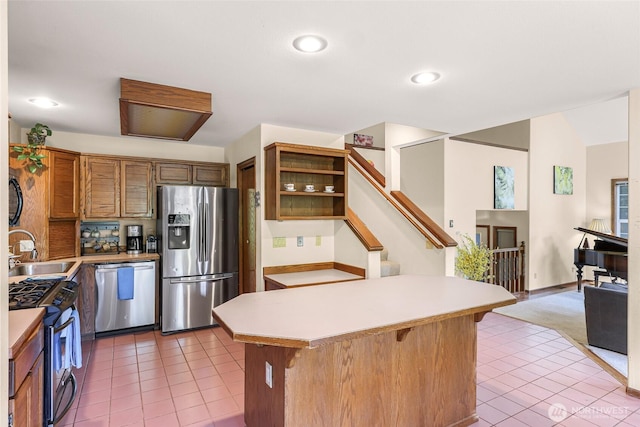 21 Longshore Ln, Bellingham, WA 98229 - kitchen with appliances with stainless steel finishes, light tile patterned floors, open shelves, light countertops, and recessed lighting