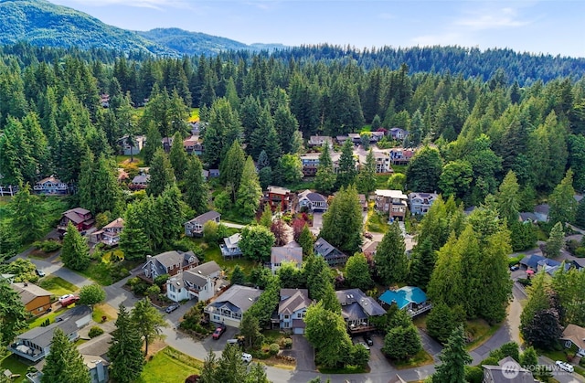 21 Longshore Ln, Bellingham, WA 98229 - aerial perspective of suburban area featuring a forest and a mountain backdrop