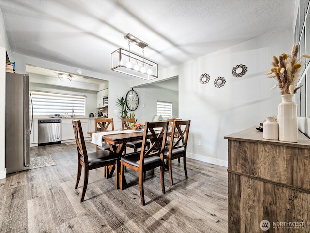 404 Nixon St S, Roy, WA 98580 - dining area with healthy amount of natural light and wood finished floors