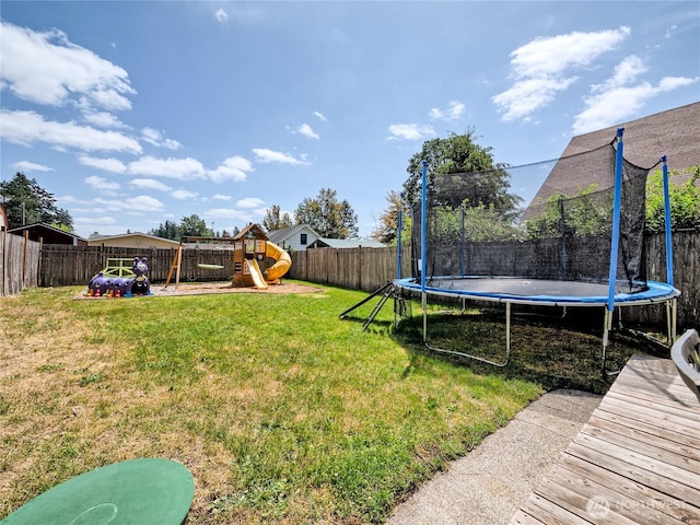 404 Nixon St S, Roy, WA 98580 - fenced backyard with a trampoline and a playground
