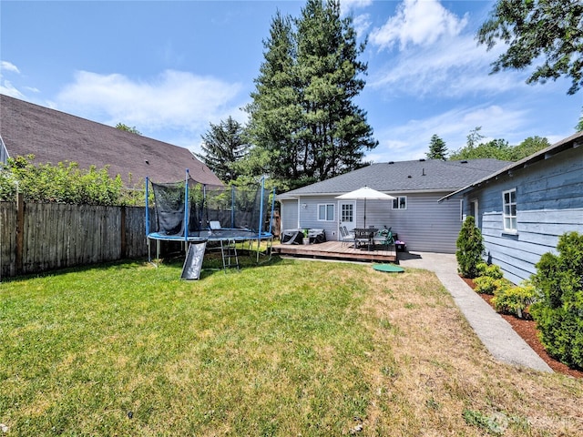 404 Nixon St S, Roy, WA 98580 - view of yard with a wooden deck and a trampoline