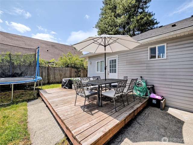 404 Nixon St S, Roy, WA 98580 - wooden terrace featuring a trampoline and outdoor dining space