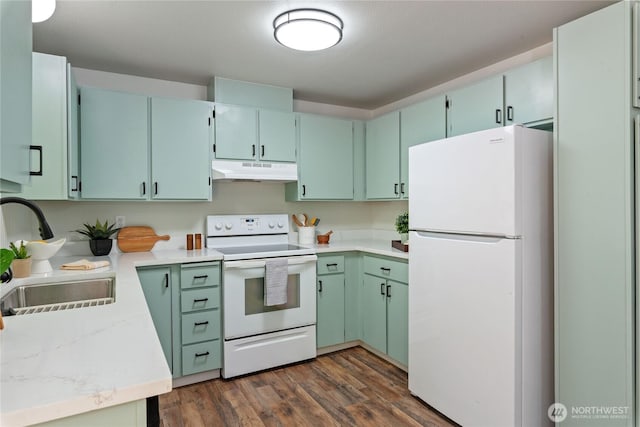 1405 Canyon Ct, Port Orchard, WA 98366 - kitchen featuring white appliances, under cabinet range hood, dark wood-type flooring, and light countertops
