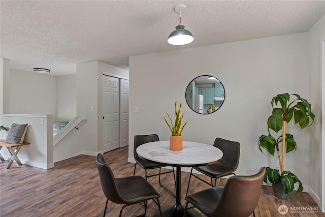 1405 Canyon Ct, Port Orchard, WA 98366 - dining area featuring a textured ceiling and wood finished floors