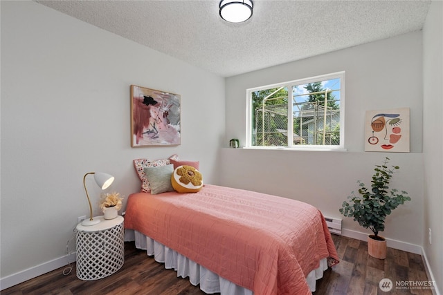 1405 Canyon Ct, Port Orchard, WA 98366 - bedroom featuring a baseboard heating unit, a textured ceiling, and wood finished floors
