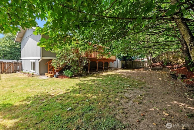 1405 Canyon Ct, Port Orchard, WA 98366 - fenced backyard with a wooden deck, a storage unit, and stairway