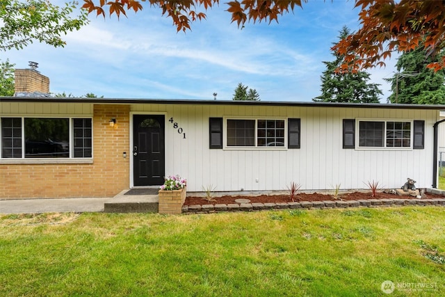 4801 78th St E, Tacoma, WA 98443 - single story home featuring a front lawn, a chimney, and brick siding