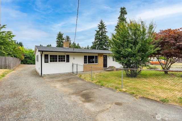 4801 78th St E, Tacoma, WA 98443 - single story home featuring gravel driveway and a chimney