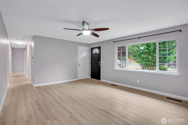 4801 78th St E, Tacoma, WA 98443 - foyer entrance with light wood-type flooring and ceiling fan
