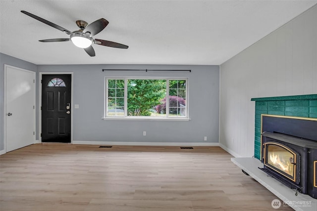 4801 78th St E, Tacoma, WA 98443 - unfurnished living room featuring light wood-style floors and a ceiling fan