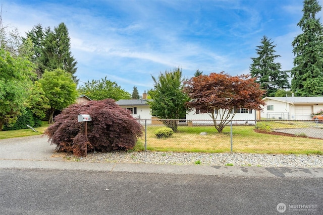 4801 78th St E, Tacoma, WA 98443 - view of property hidden behind natural elements with a fenced front yard