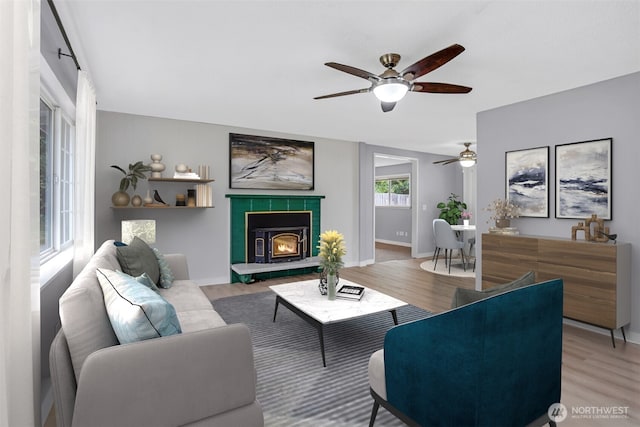 4801 78th St E, Tacoma, WA 98443 - living area featuring a ceiling fan, light wood-style flooring, and a tile fireplace