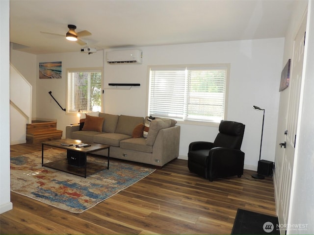 14808 131st Ave SE, Renton, WA 98058 - living room with a wall mounted AC, wood finished floors, a ceiling fan, and stairway