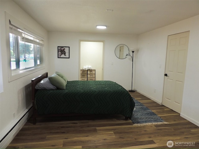 14808 131st Ave SE, Renton, WA 98058 - bedroom featuring a baseboard heating unit and wood finished floors