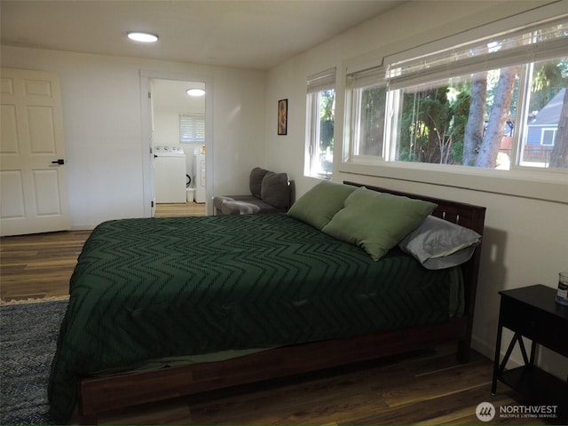 14808 131st Ave SE, Renton, WA 98058 - bedroom with washing machine and dryer, dark wood-style flooring, and recessed lighting