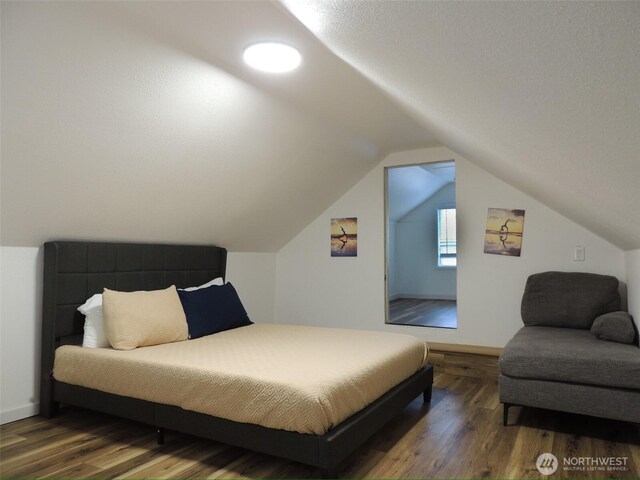 14808 131st Ave SE, Renton, WA 98058 - bedroom with wood finished floors and lofted ceiling