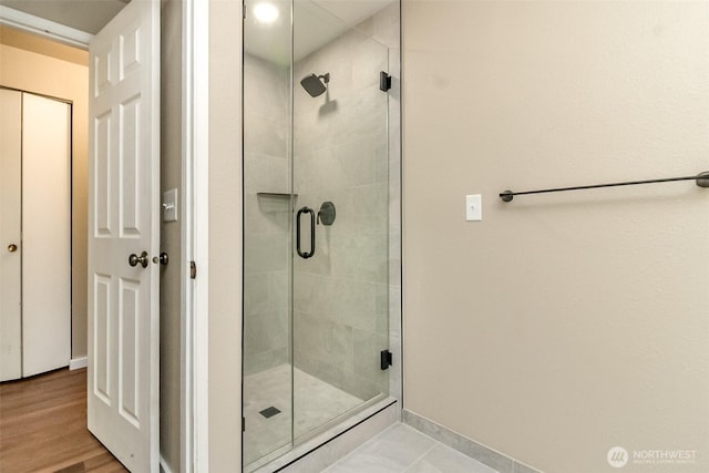 7308 N Skyview Ln Unit I-304, Tacoma, WA 98406 - bathroom with a stall shower and baseboards