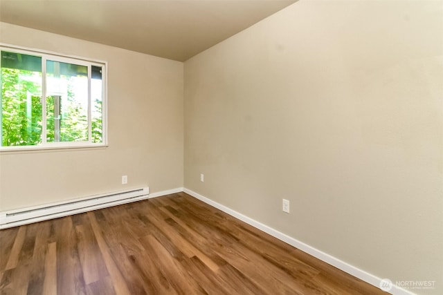 7308 N Skyview Ln Unit I-304, Tacoma, WA 98406 - unfurnished room with baseboard heating and wood finished floors