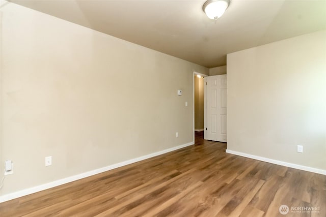 7308 N Skyview Ln Unit I-304, Tacoma, WA 98406 - empty room featuring wood finished floors and baseboards