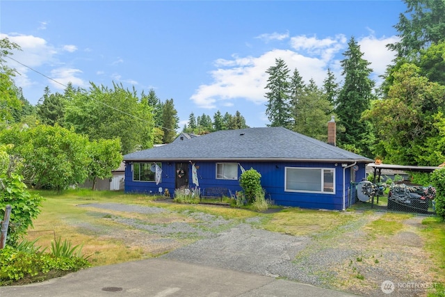 14222 4th Ave SW, Burien, WA 98166 - view of front of house featuring a chimney, roof with shingles, driveway, and a front lawn