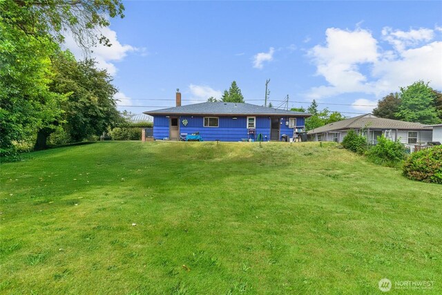 14222 4th Ave SW, Burien, WA 98166 - rear view of house featuring a chimney and a lawn