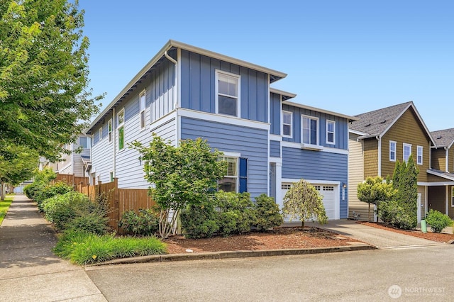 3613 198th Pl SE, Bothell, WA 98012 - view of front of house featuring board and batten siding, driveway, and an attached garage