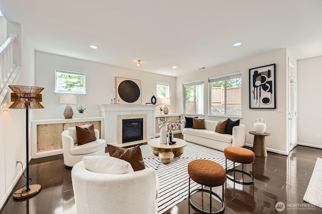 3613 198th Pl SE, Bothell, WA 98012 - living room with healthy amount of natural light, dark wood-style floors, a fireplace with flush hearth, and recessed lighting