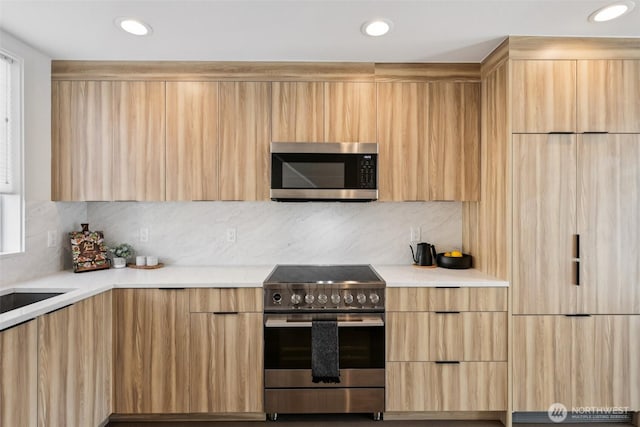 4303 Dayton Ave N Unit E, Seattle, WA 98103 - kitchen featuring appliances with stainless steel finishes, modern cabinets, light brown cabinets, and recessed lighting