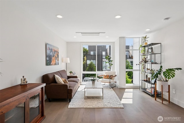 4303 Dayton Ave N Unit E, Seattle, WA 98103 - living area with wood finished floors, recessed lighting, and expansive windows