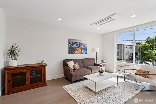 4303 Dayton Ave N Unit E, Seattle, WA 98103 - living area featuring wood finished floors and recessed lighting