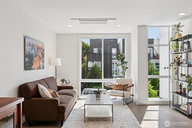 4303 Dayton Ave N Unit E, Seattle, WA 98103 - living room featuring wood finished floors and floor to ceiling windows